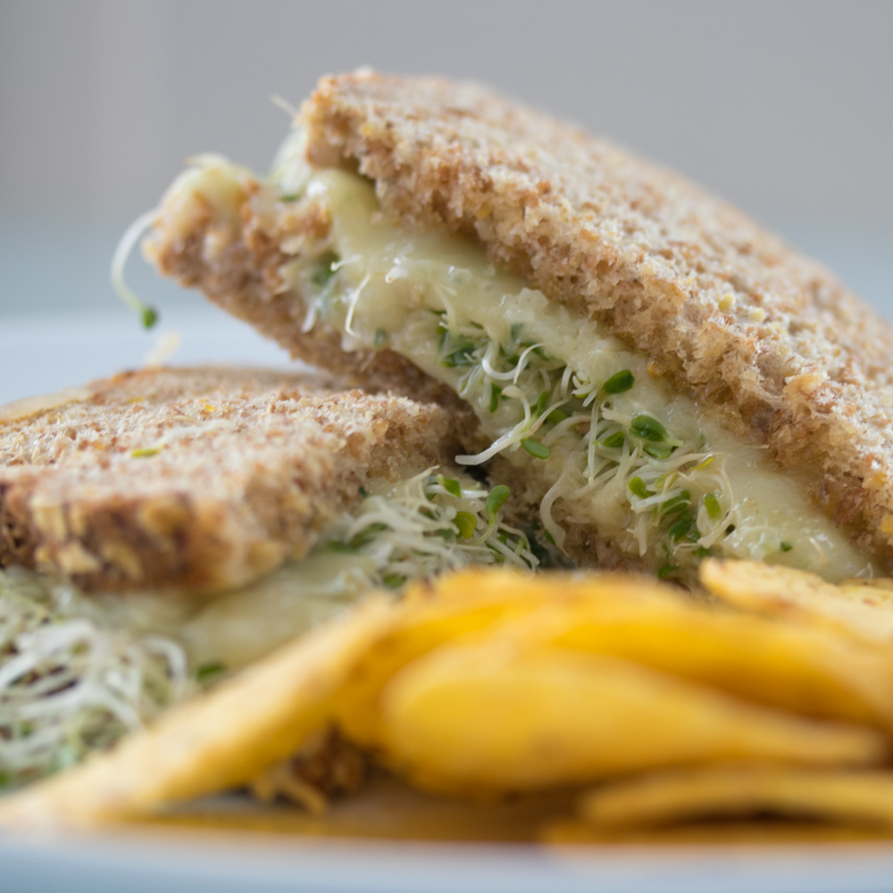 Meatless sandwich with sprouts and chips, a Lent-friendly lunch option